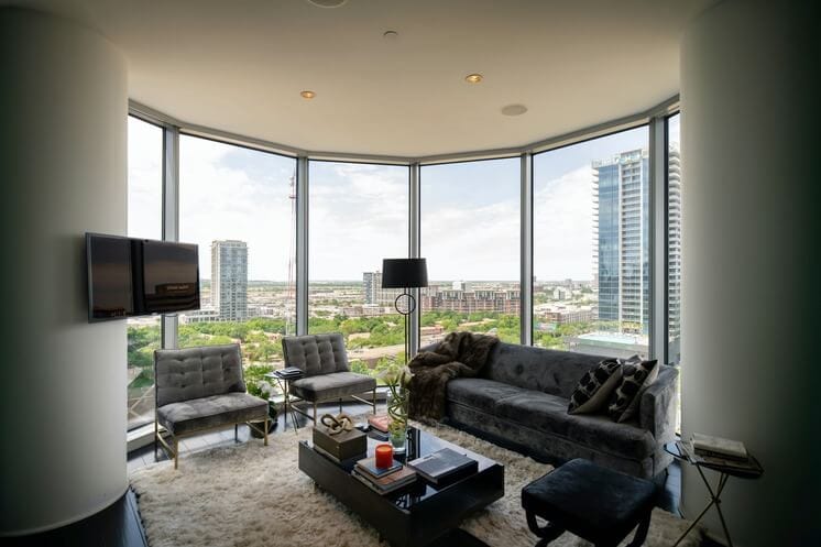 Living room with panoramic city view through large windows